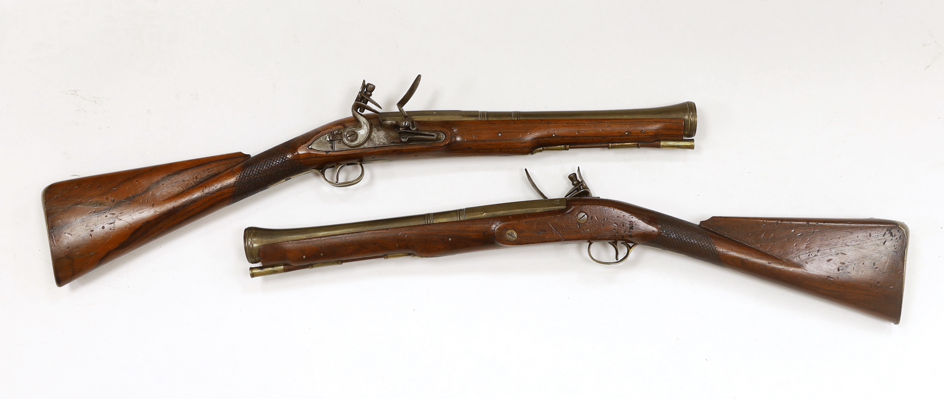 A pair of reproduction 'York Mail' flintlock blunderbusses in a late 18th century style.